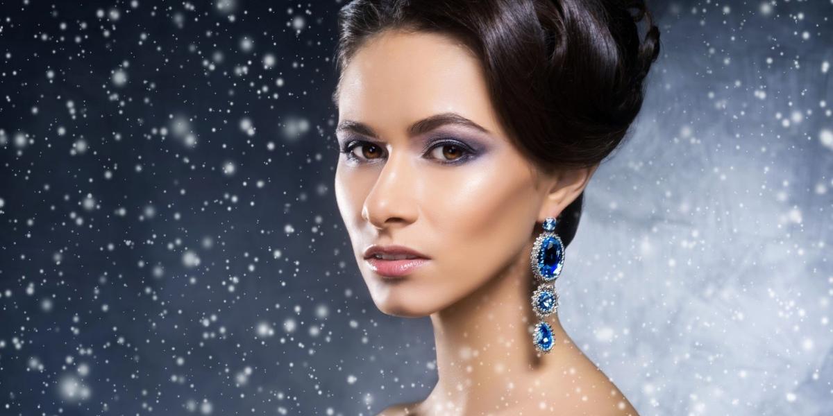 A woman wearing sapphire winter jewellery.