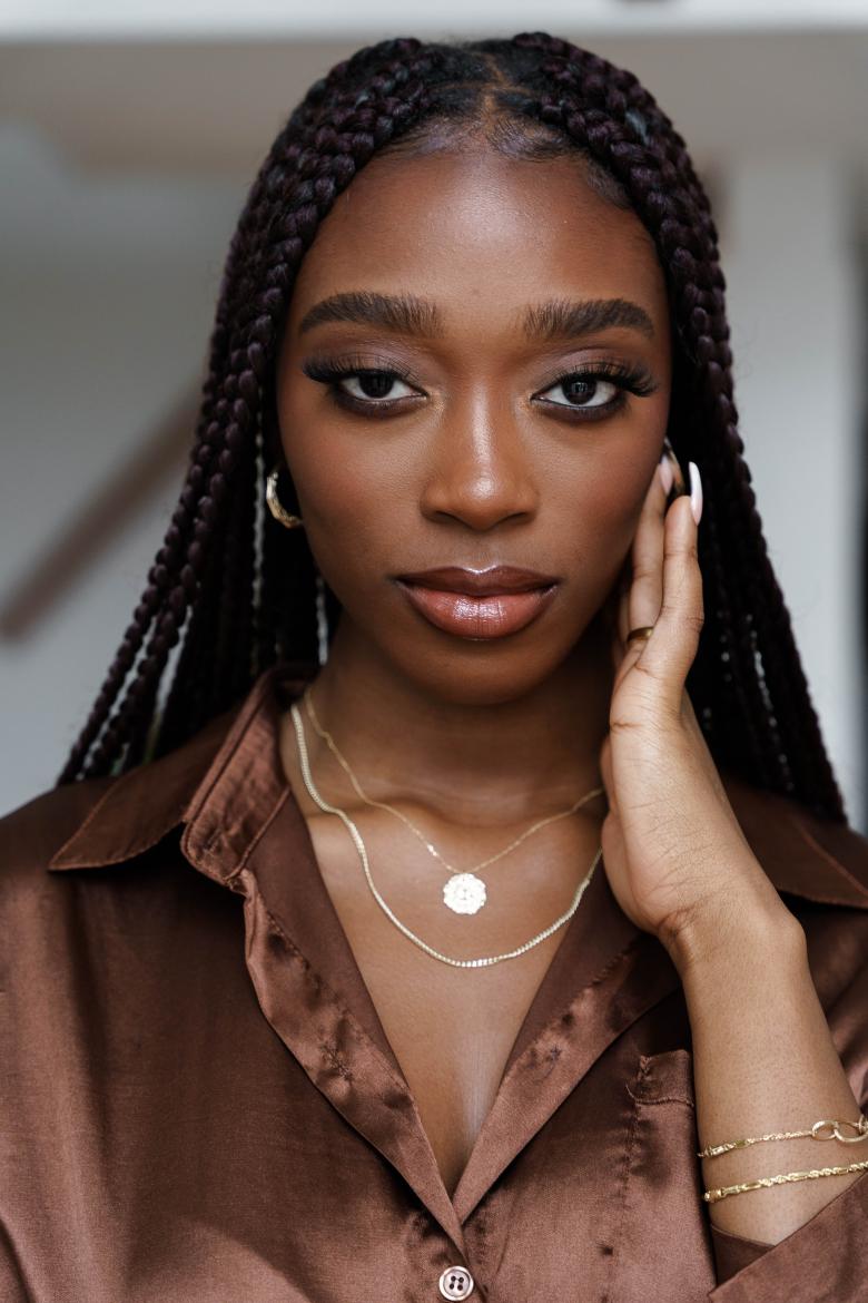 young woman wearing tuscany gold jewelry 